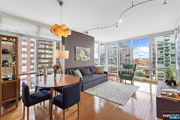 a living room with fireplace furniture and a wooden floor