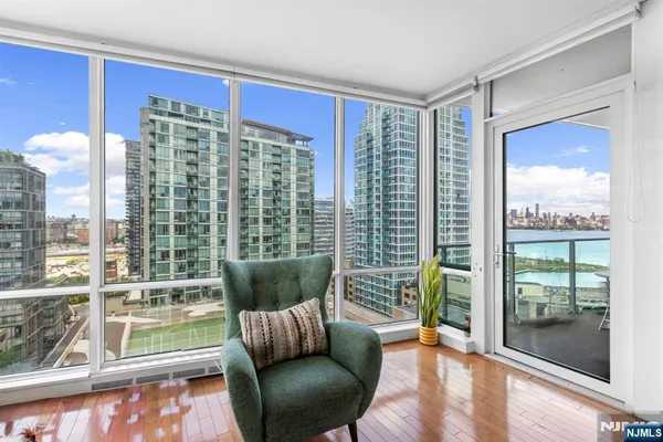a living room with furniture and a large window