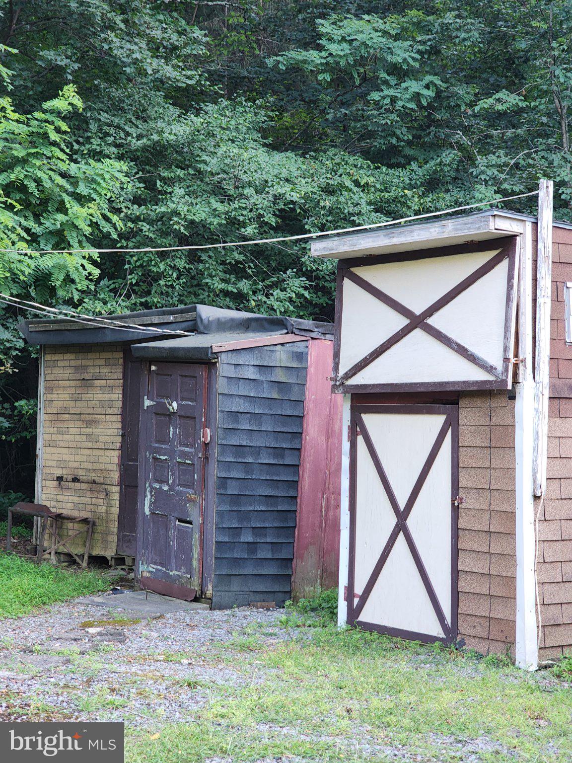 85 Couch Road Blain, PA 17006 - Photo 11 of 13 Charming rustic sheds in nature's embrace.