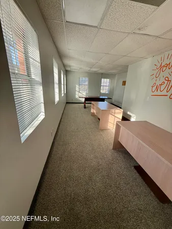 a bedroom with furniture and a window