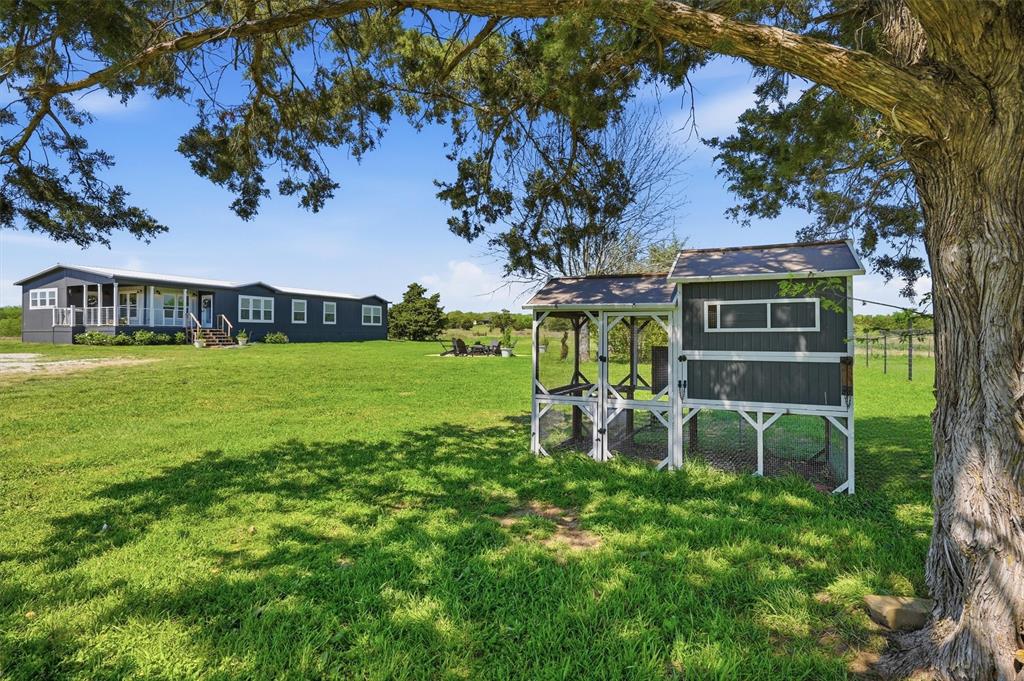249 Mt Pleasant Road Valley View, TX 76272 - Photo 2 of 40 a view of a house with a yard porch and sitting area