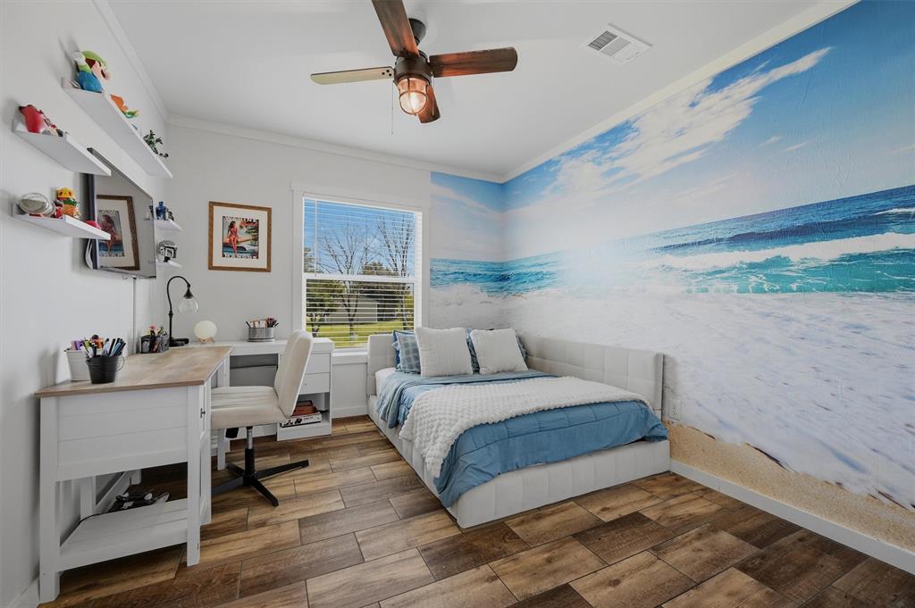 249 Mt Pleasant Road Valley View, TX 76272 - Photo 30 of 40 a bedroom with a bed and a desk