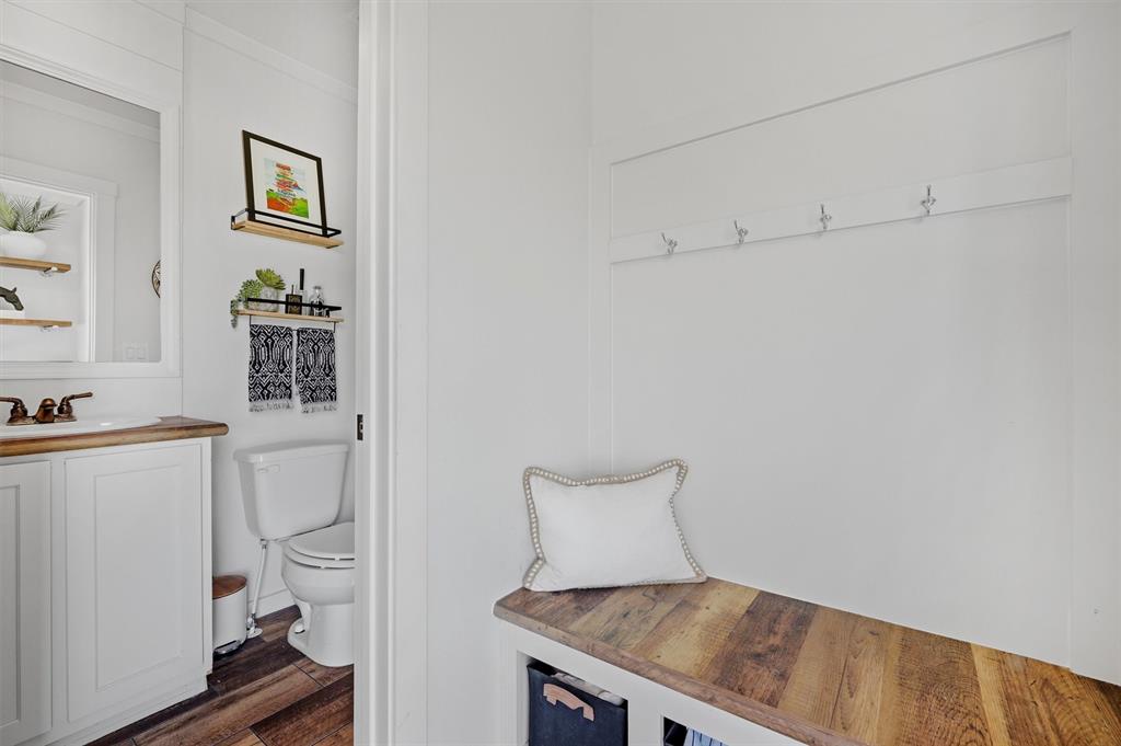 249 Mt Pleasant Road Valley View, TX 76272 - Photo 32 of 40 a room with a cabinets and toilet