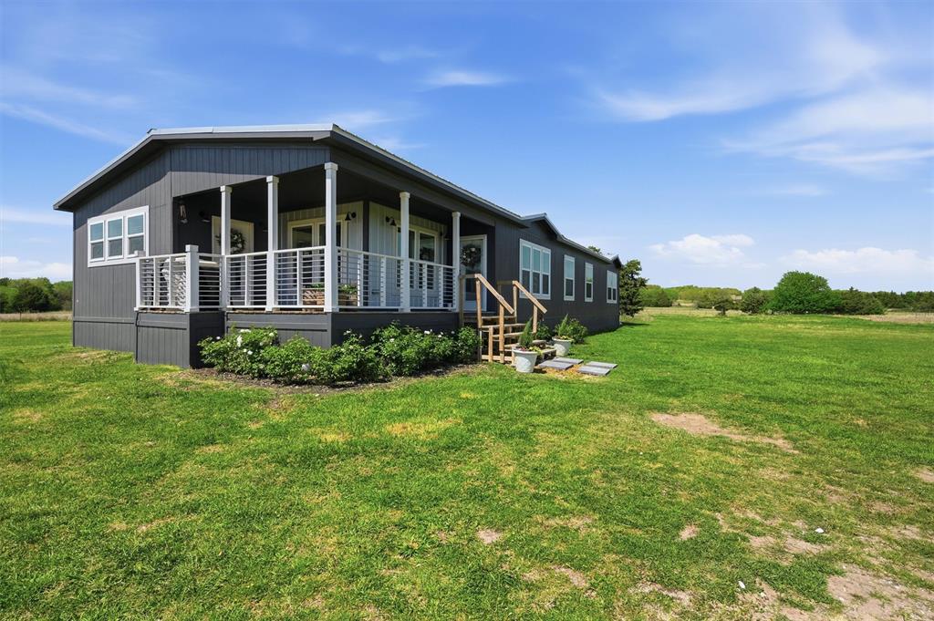249 Mt Pleasant Road Valley View, TX 76272 - Photo 4 of 40 a view of a house with a yard