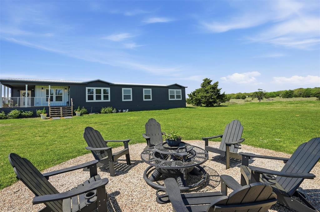 249 Mt Pleasant Road Valley View, TX 76272 - Photo 6 of 40 a view of a patio with chair and table