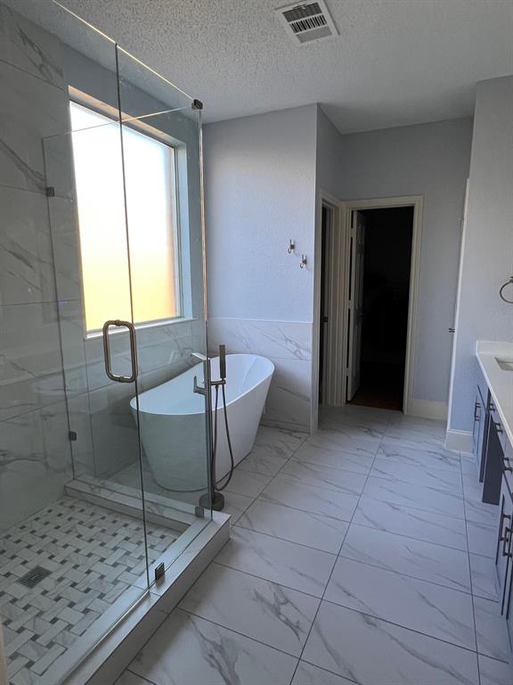 1224 Harvard Lane Allen, TX 75002 - Photo 7 of 26 Large Glass Shower, this bath features double sink quartz vanity with dual lighted mirrors, free standing Tub, private toilet room and large walk-in closet.