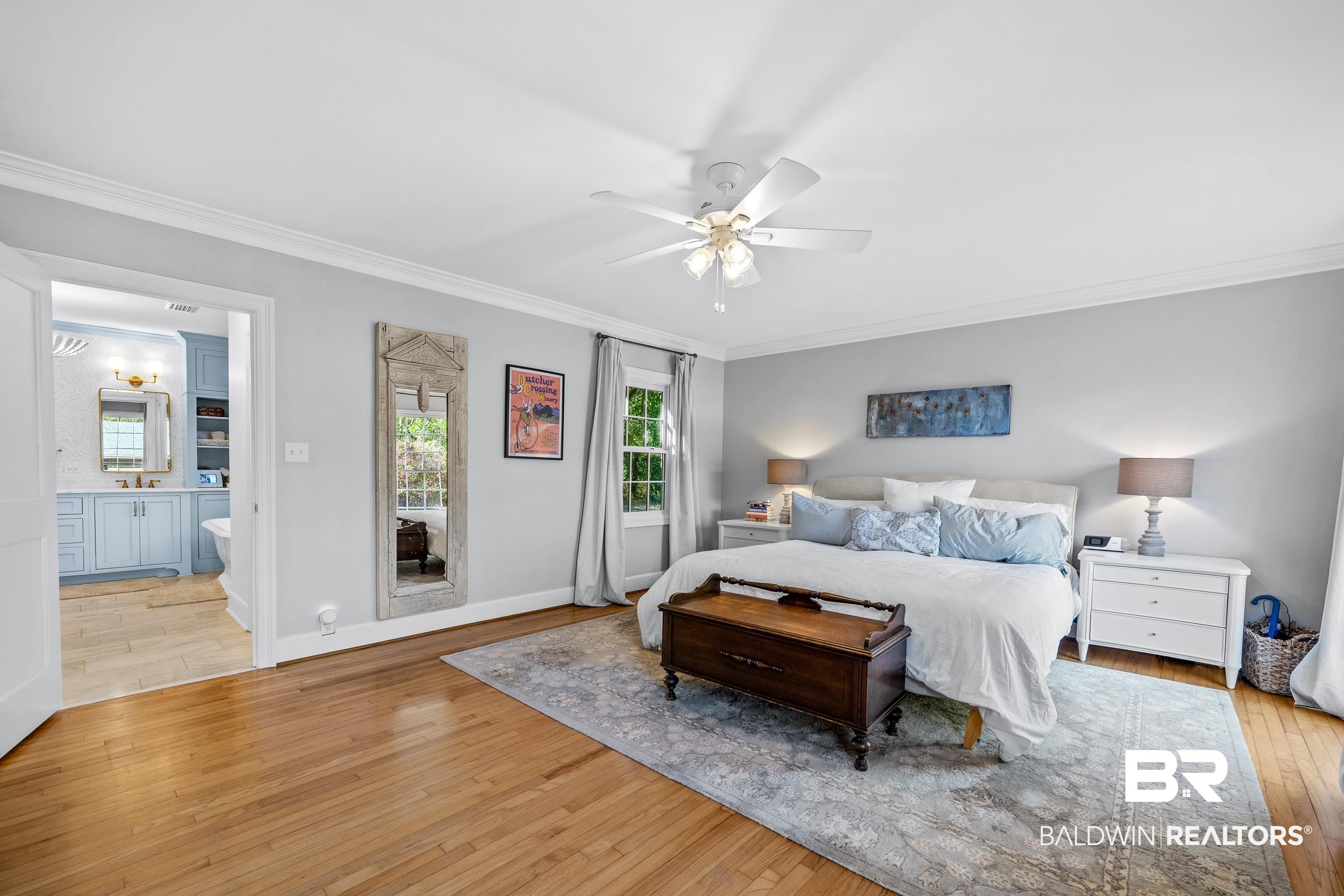 141 Myrtlewood Lane Mobile, AL 36608 - Photo 22 of 44 Bedroom featuring baseboards, ornamental molding, connected bathroom, a ceiling fan, and hardwood / wood-style floors