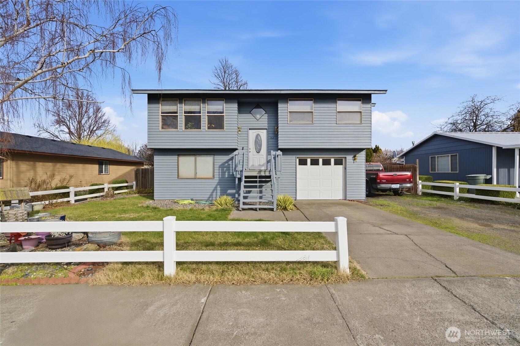 a front view of a house with a yard
