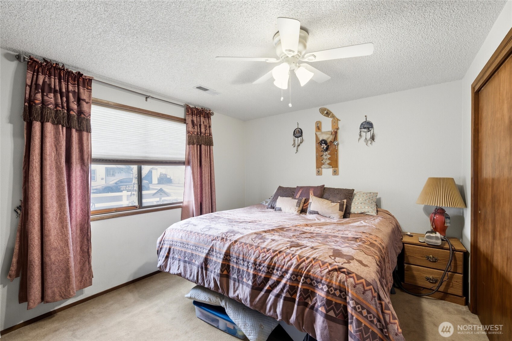 162 Tara Street Milton Freewater, OR 97862 - Photo 16 of 21 a bedroom with a bed and a chandelier