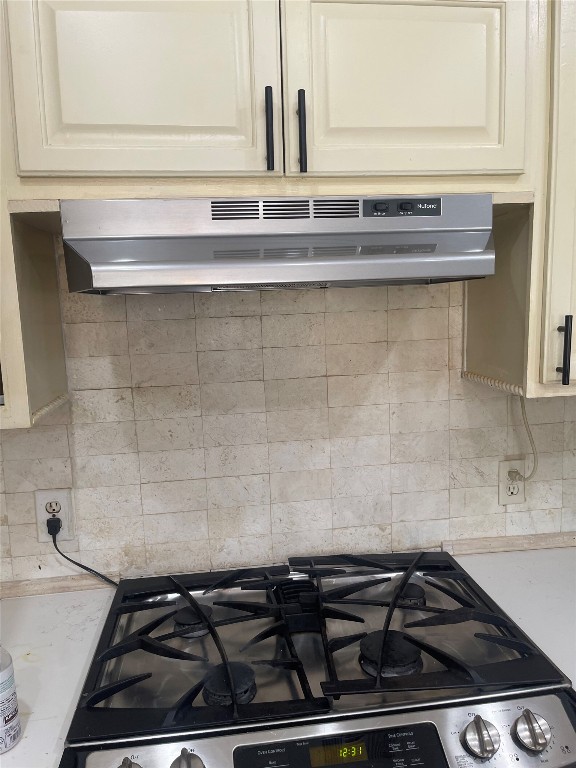 6906 Bayridge Terrace Austin, TX 78759 - Photo 13 of 35 a close view of a stove a microwave and cabinets
