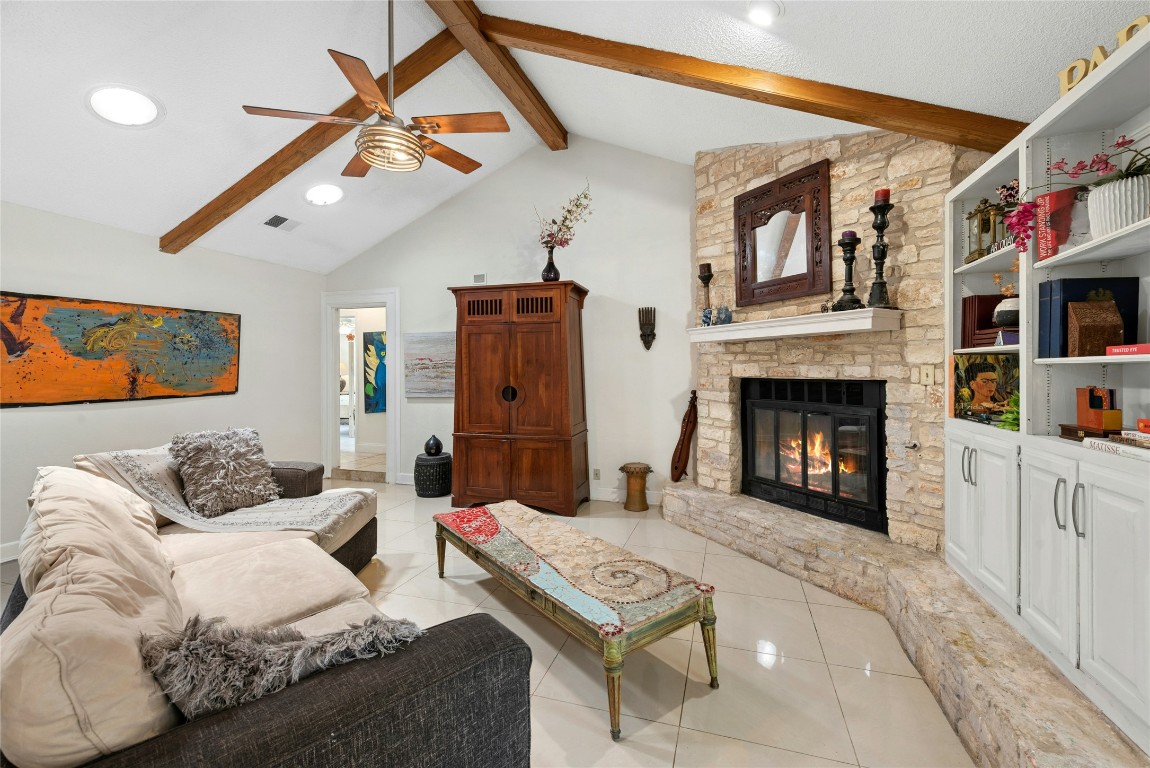 6906 Bayridge Terrace Austin, TX 78759 - Photo 14 of 35 a living room with furniture and a fireplace