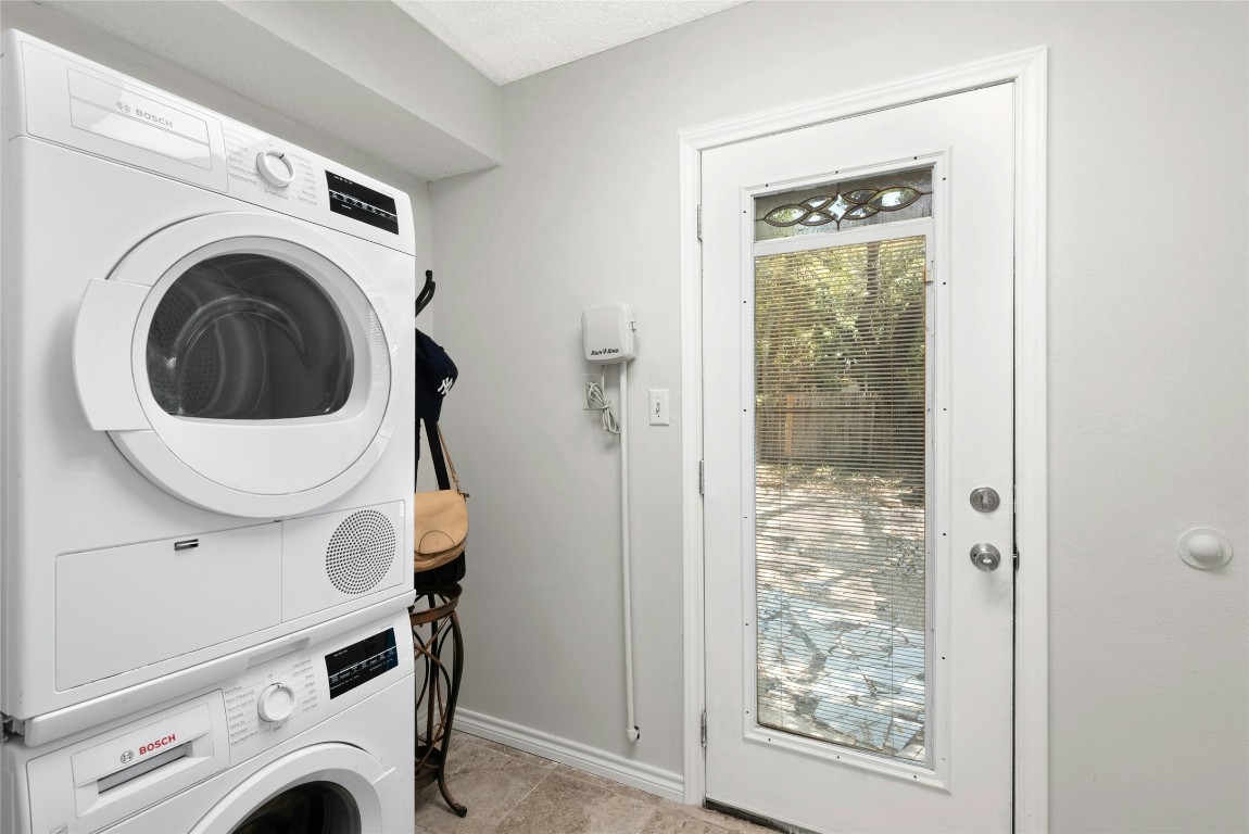 6906 Bayridge Terrace Austin, TX 78759 - Photo 23 of 35 a view of entryway with washer and dryer