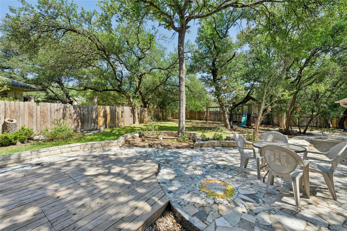 6906 Bayridge Terrace Austin, TX 78759 - Photo 33 of 35 a view of a backyard with sitting area