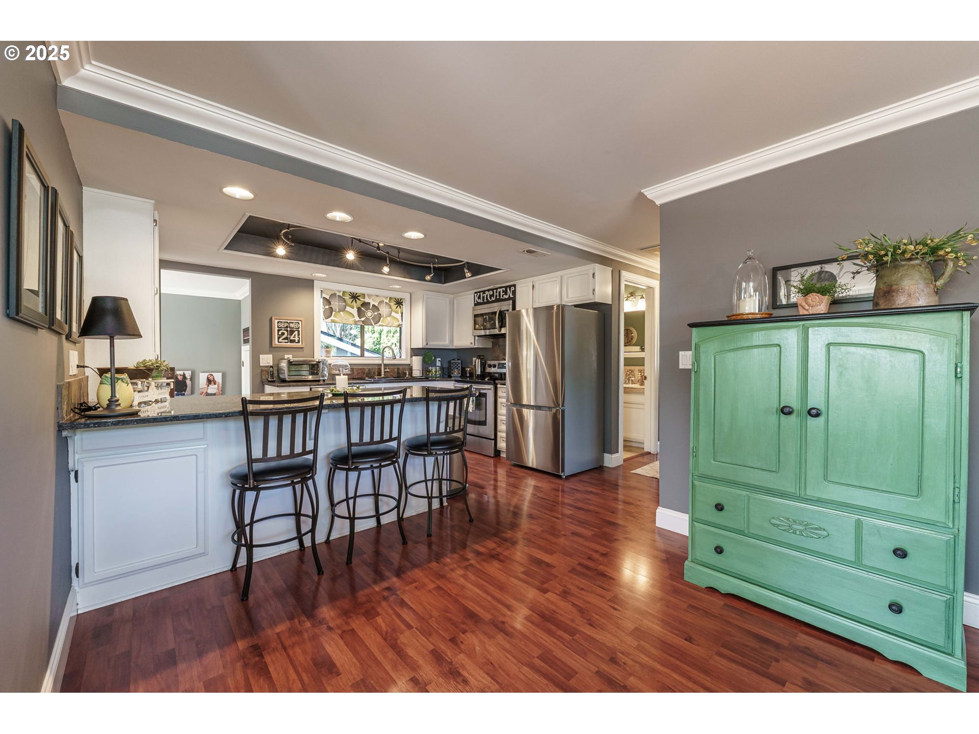 737 Northwest 20th Avenue Camas, WA 98607 - Photo 12 of 40 a open kitchen with stainless steel appliances granite countertop a refrigerator a sink and a wooden cabinets