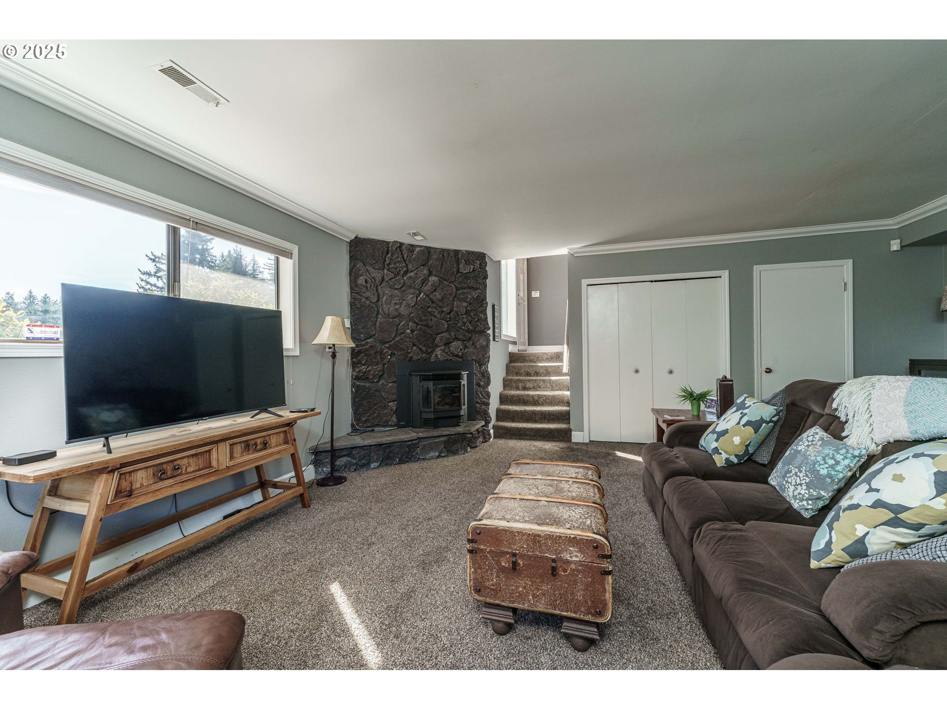 737 Northwest 20th Avenue Camas, WA 98607 - Photo 26 of 40 a living room with furniture and a flat screen tv