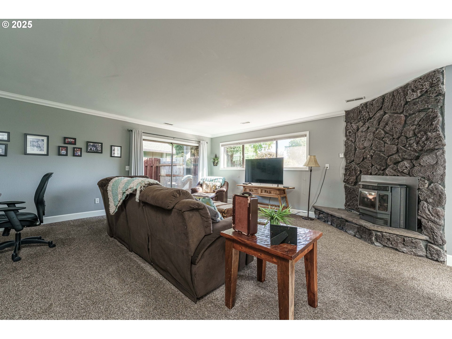 737 Northwest 20th Avenue Camas, WA 98607 - Photo 27 of 40 a living room with furniture a window and a fireplace
