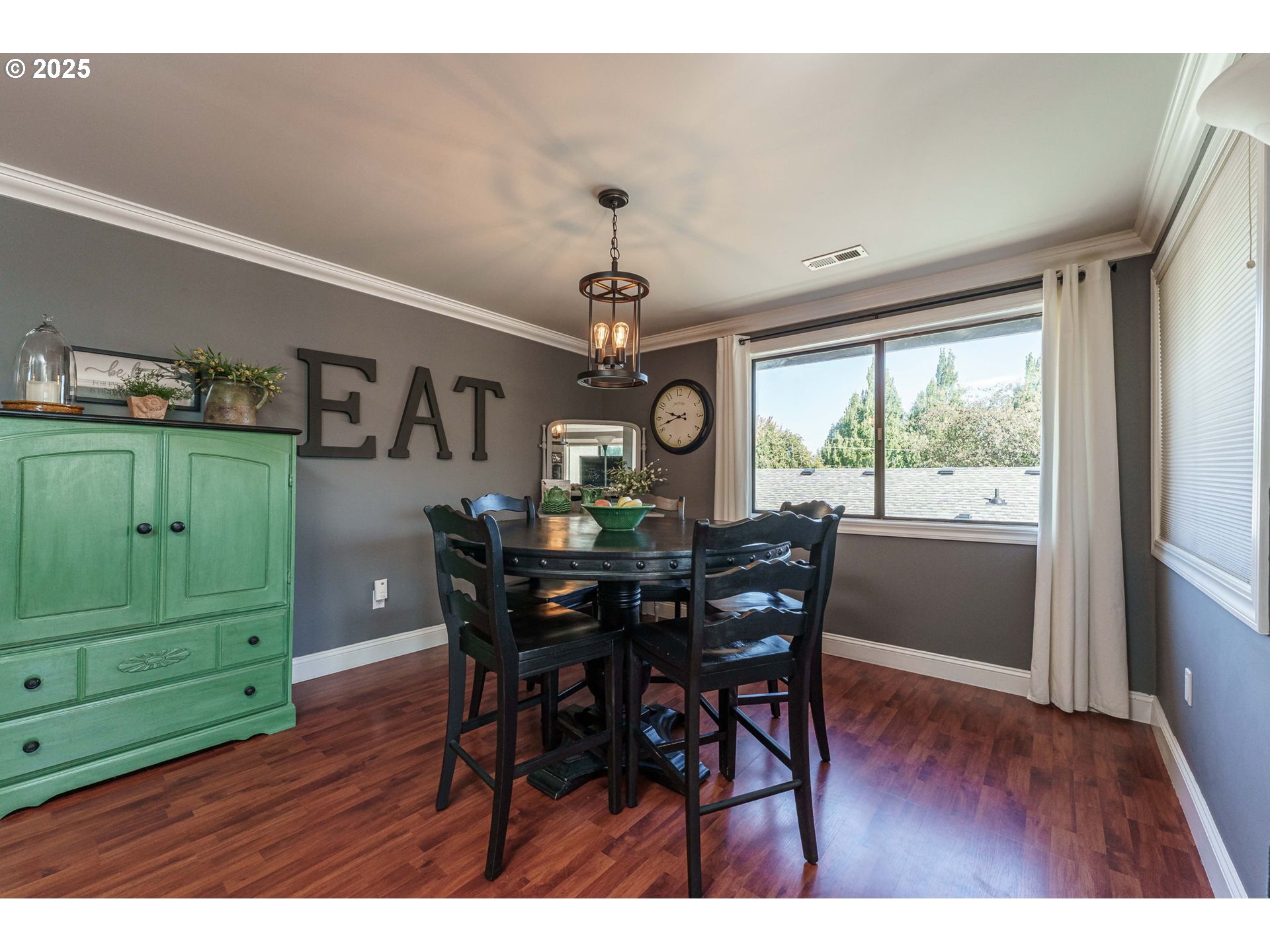 737 Northwest 20th Avenue Camas, WA 98607 - Photo 10 of 40 a view of a dining room with furniture window and wooden floor