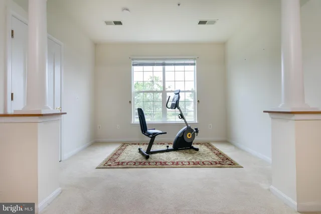 a view of a workspace with furniture