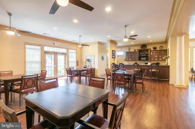 a view of a dining area with furniture window and wooden floor