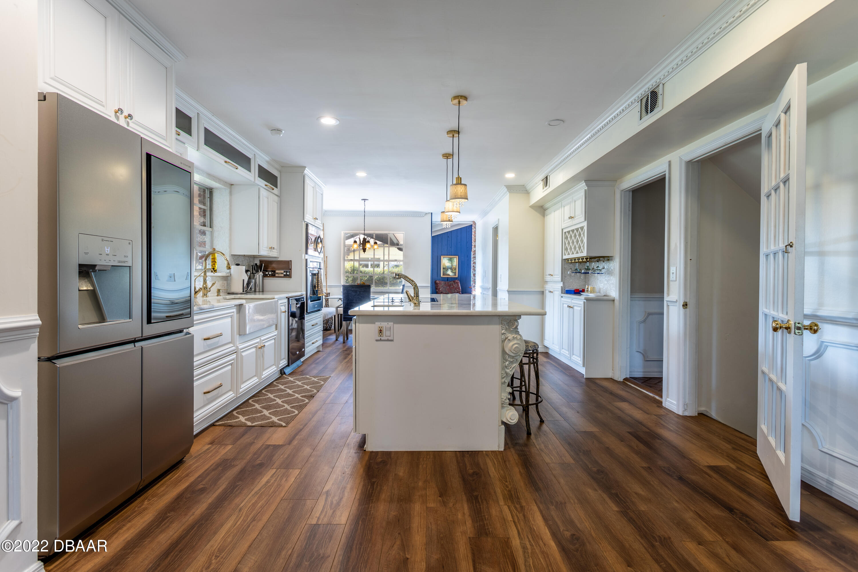 82 North St Andrews Drive Ormond Beach, FL 32174 - Photo 12 of 60 a large kitchen with a lot of counter space and stainless steel appliances