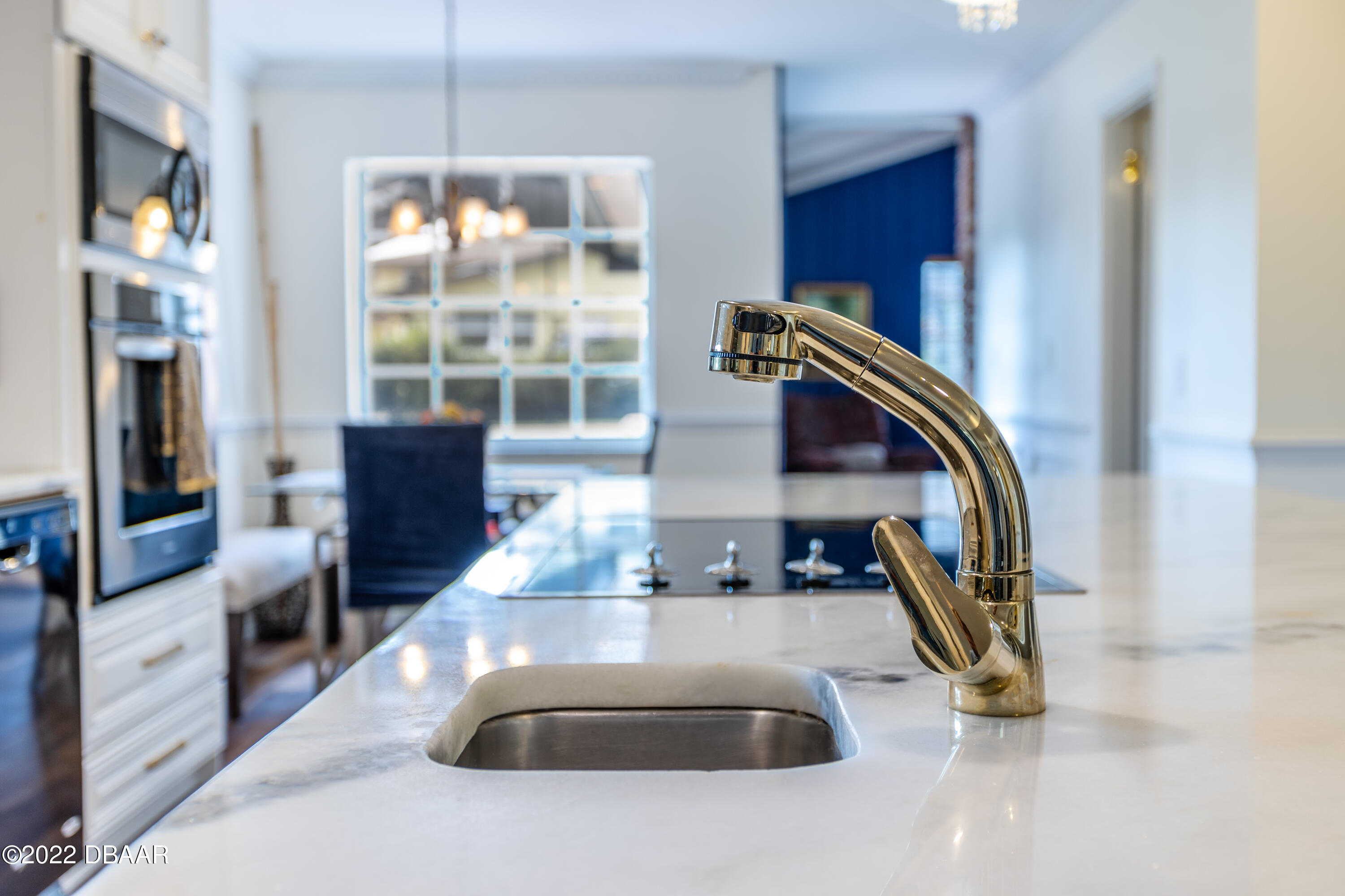 82 North St Andrews Drive Ormond Beach, FL 32174 - Photo 15 of 60 a kitchen with stainless steel appliances granite countertop a sink and a refrigerator