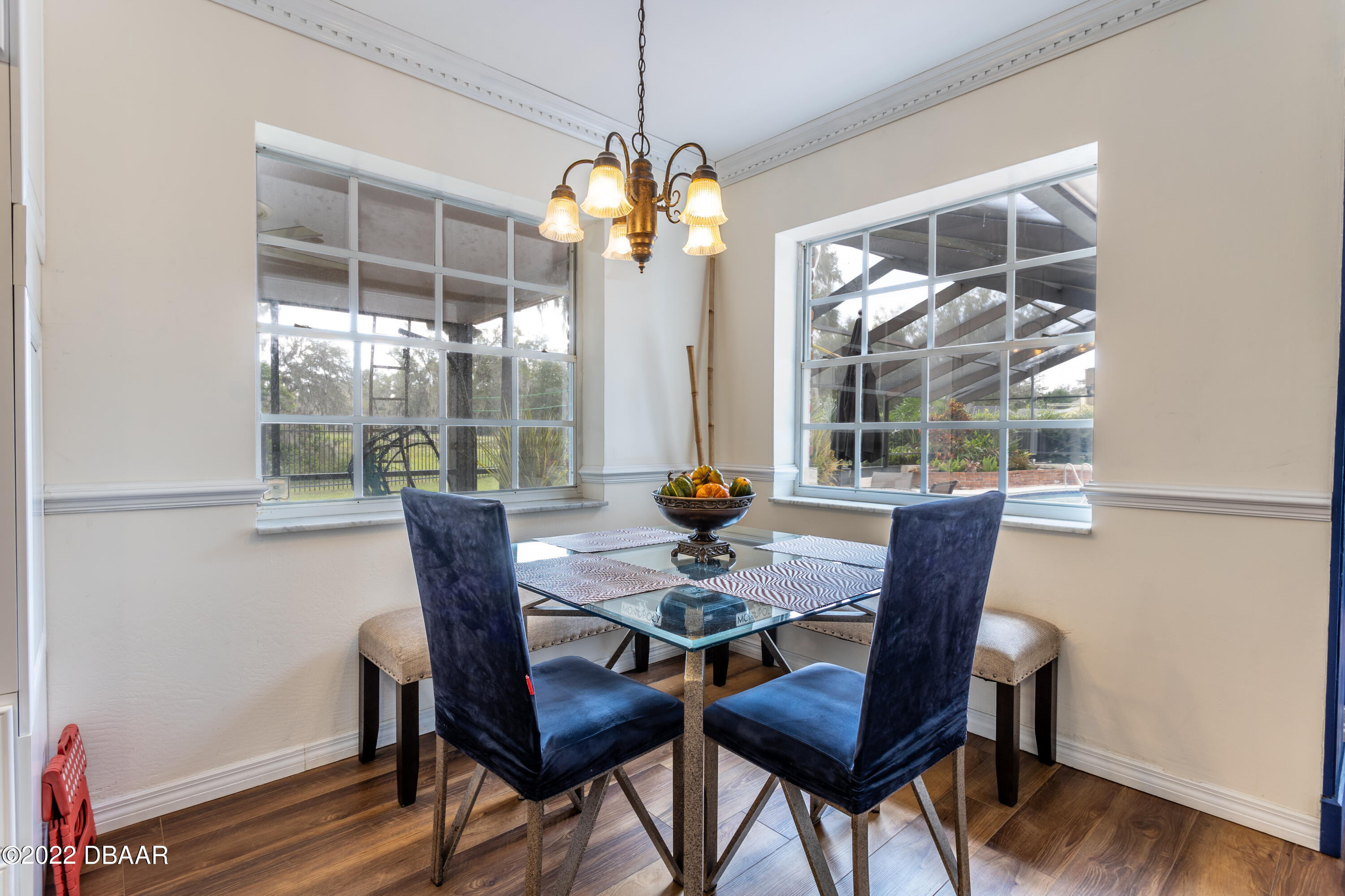 82 North St Andrews Drive Ormond Beach, FL 32174 - Photo 18 of 60 a view of a dining room with furniture window and wooden floor