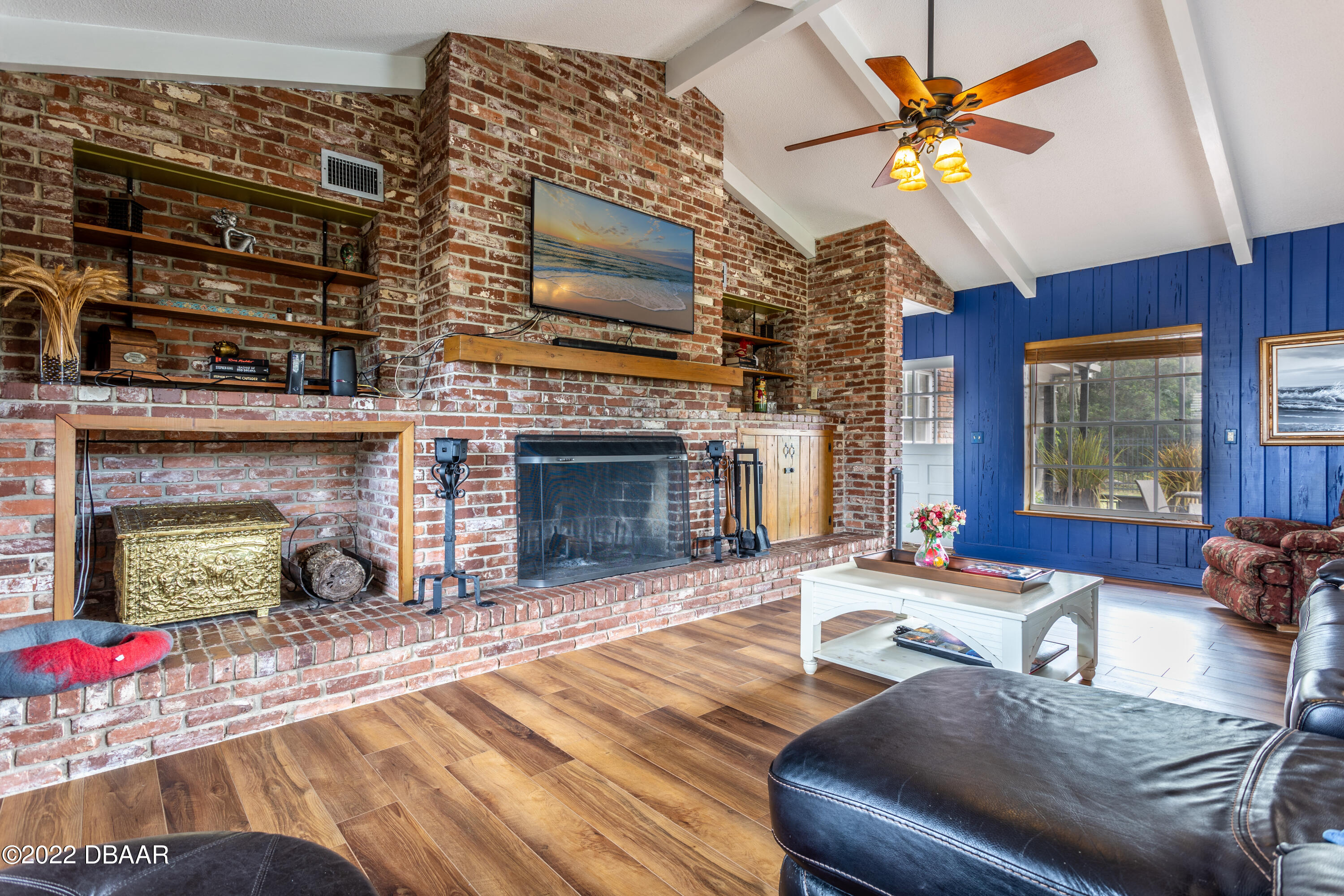 82 North St Andrews Drive Ormond Beach, FL 32174 - Photo 20 of 60 a living room with furniture and a fireplace