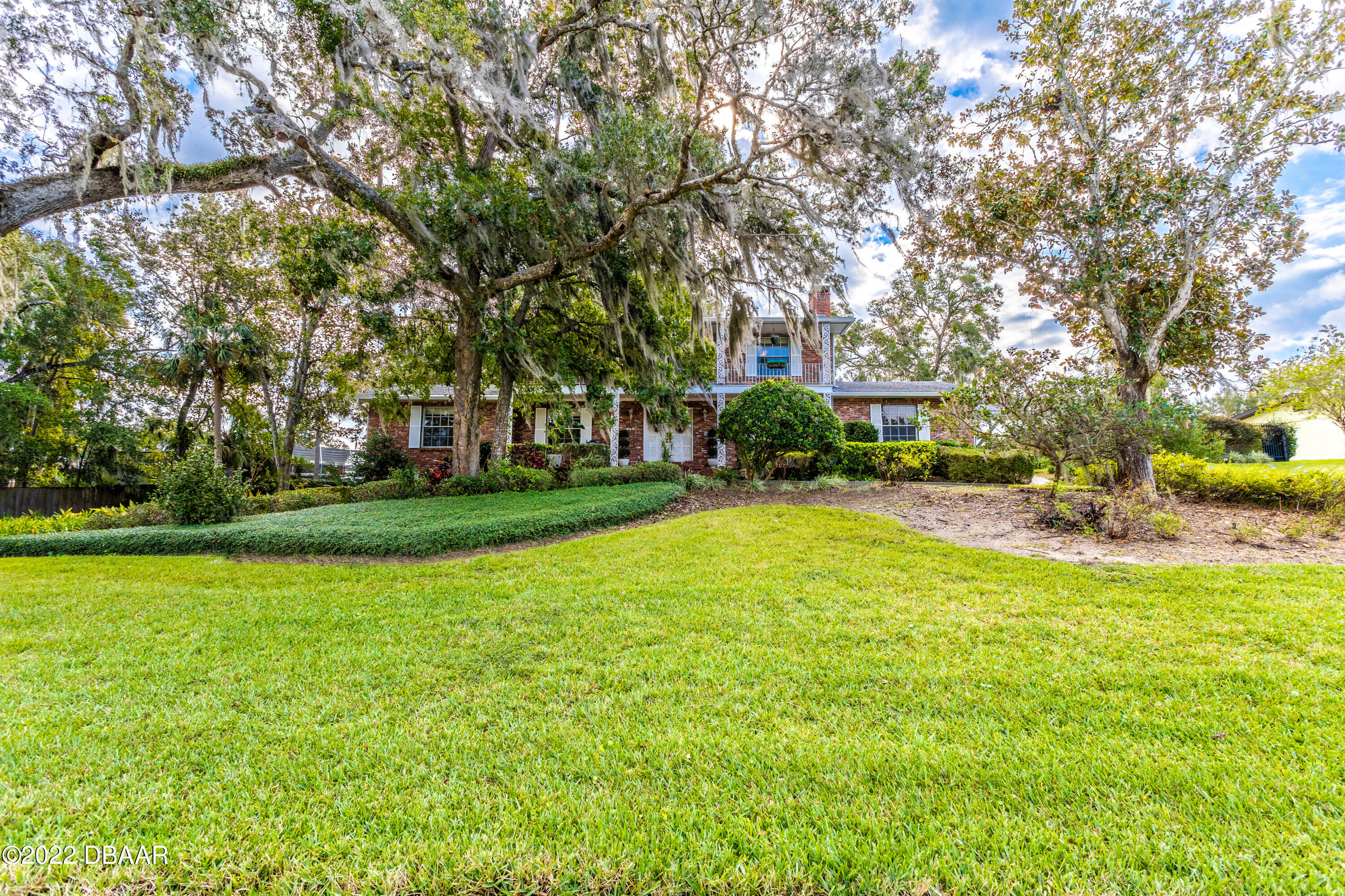 82 North St Andrews Drive Ormond Beach, FL 32174 - Photo 2 of 60 a view of yard with swimming pool and green space