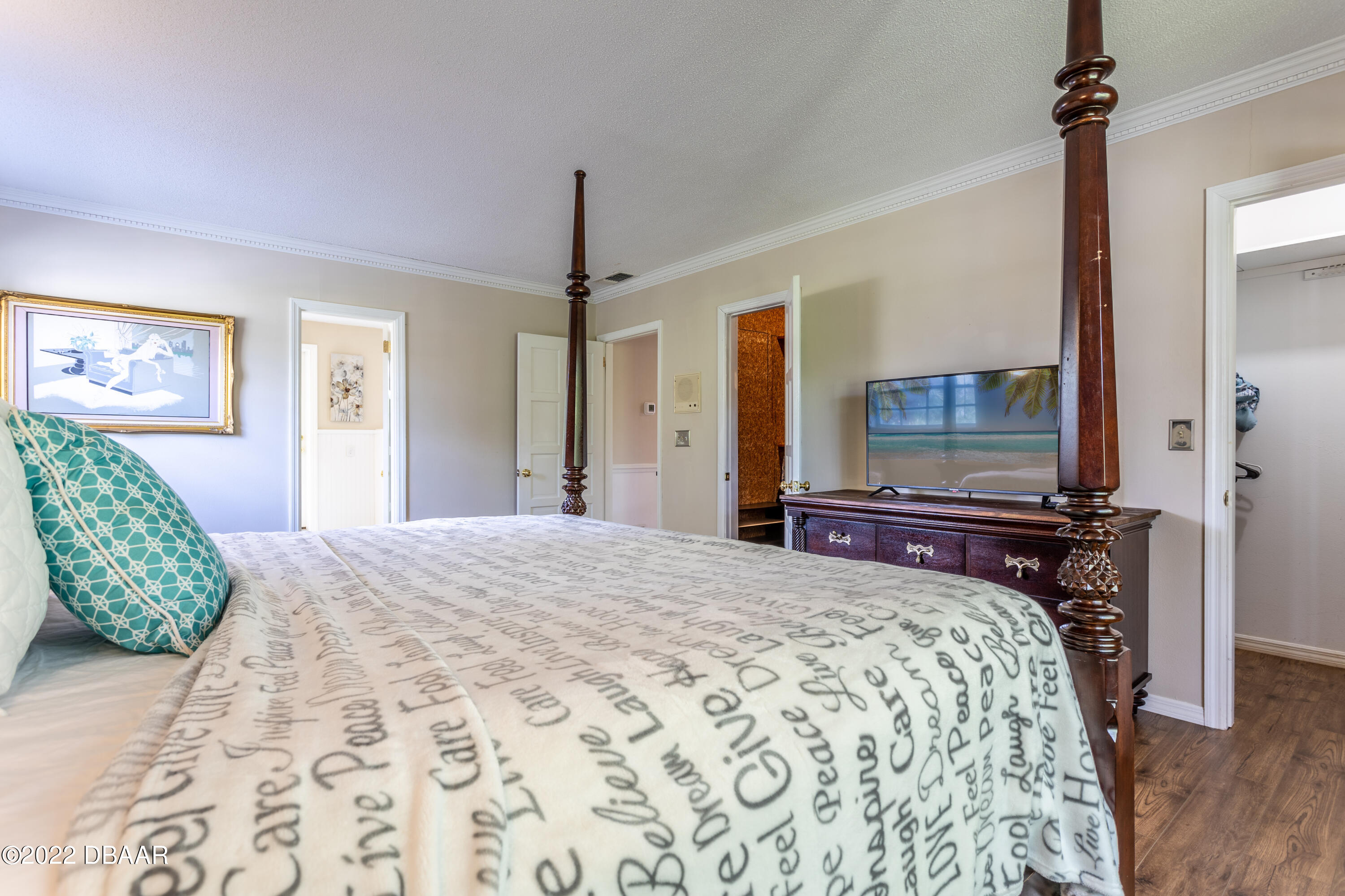 82 North St Andrews Drive Ormond Beach, FL 32174 - Photo 46 of 60 a bedroom with a bed and a flat screen tv