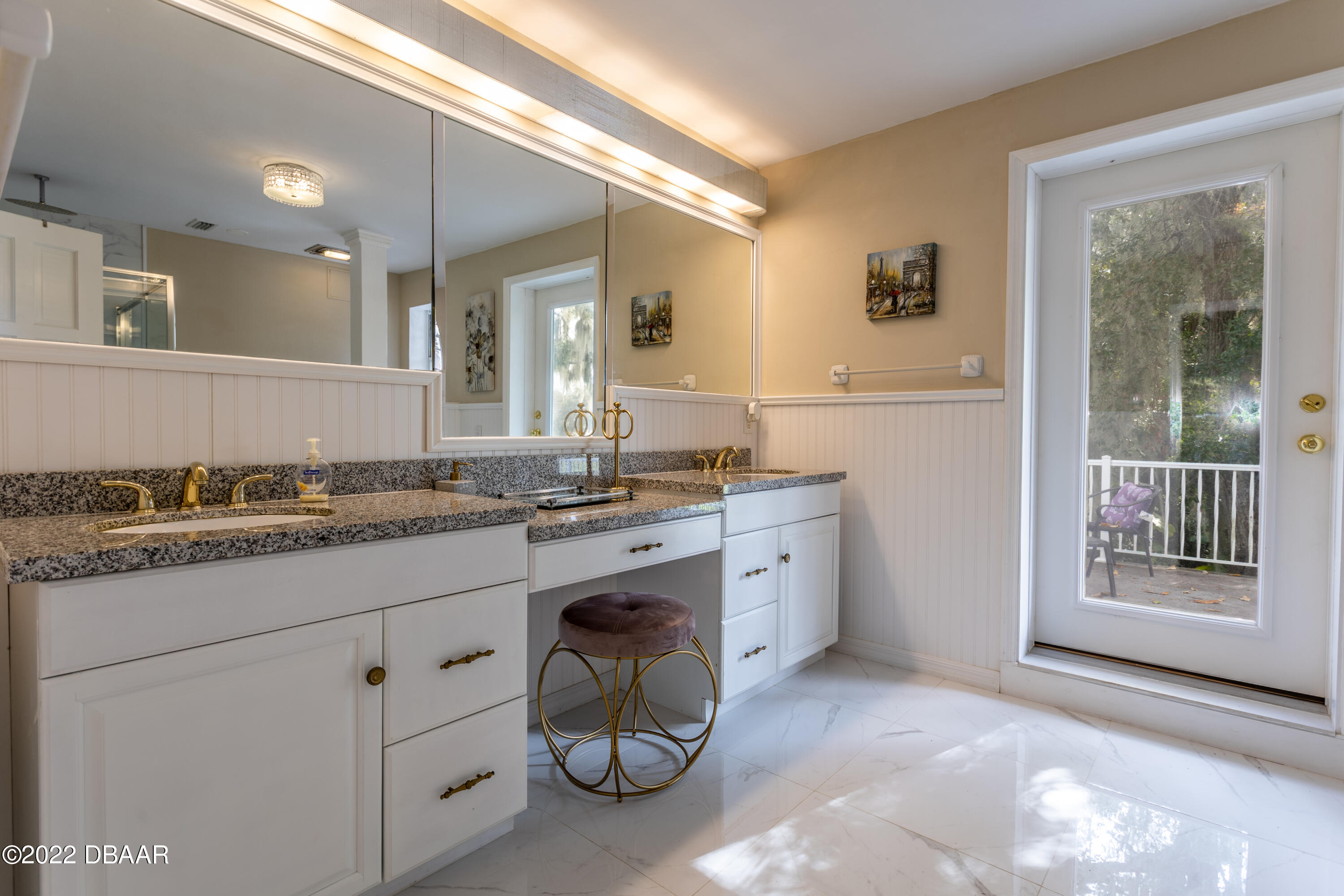 82 North St Andrews Drive Ormond Beach, FL 32174 - Photo 49 of 60 a bathroom with a granite countertop sink and a mirror