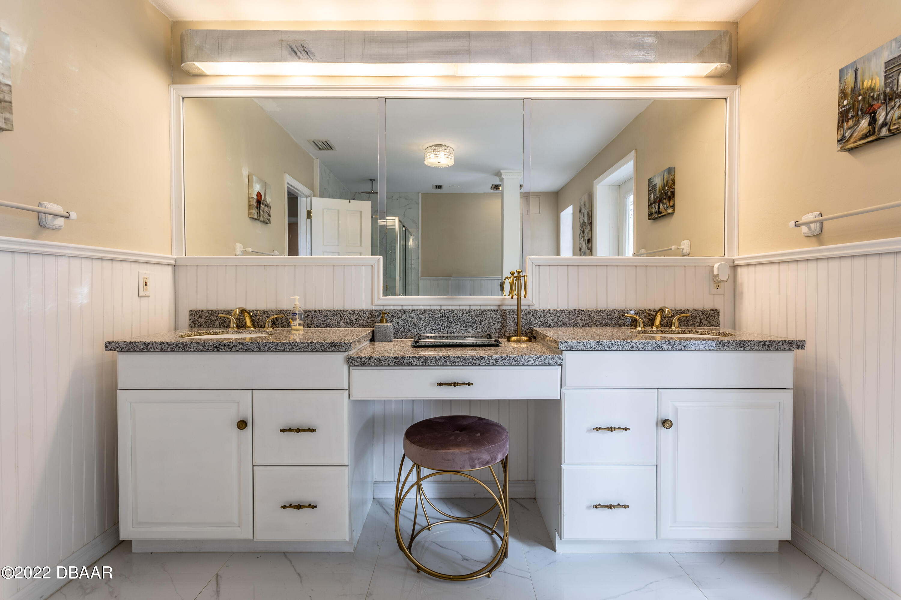 82 North St Andrews Drive Ormond Beach, FL 32174 - Photo 51 of 60 a bathroom with a granite countertop sink and a mirror