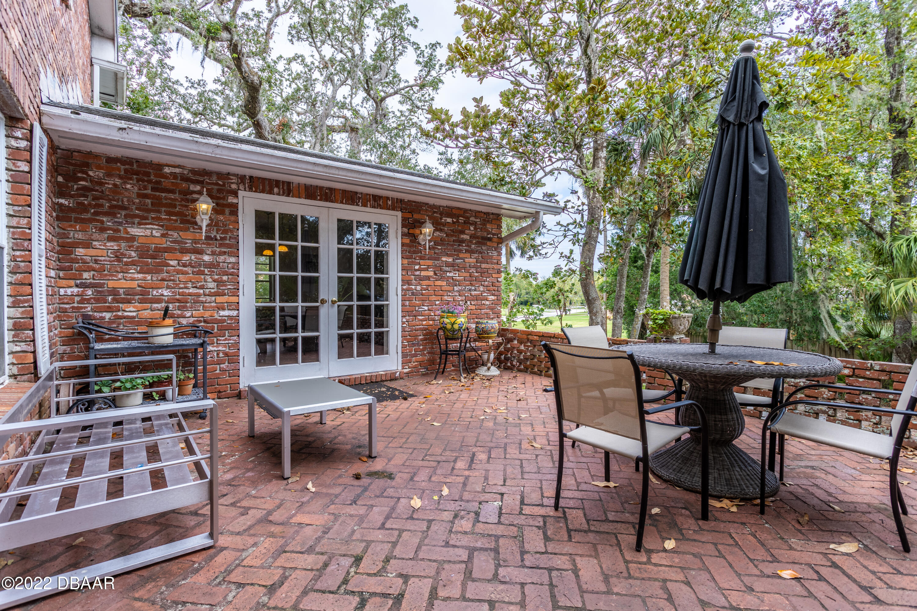 82 North St Andrews Drive Ormond Beach, FL 32174 - Photo 53 of 60 a view of a backyard with furniture and outdoor seating