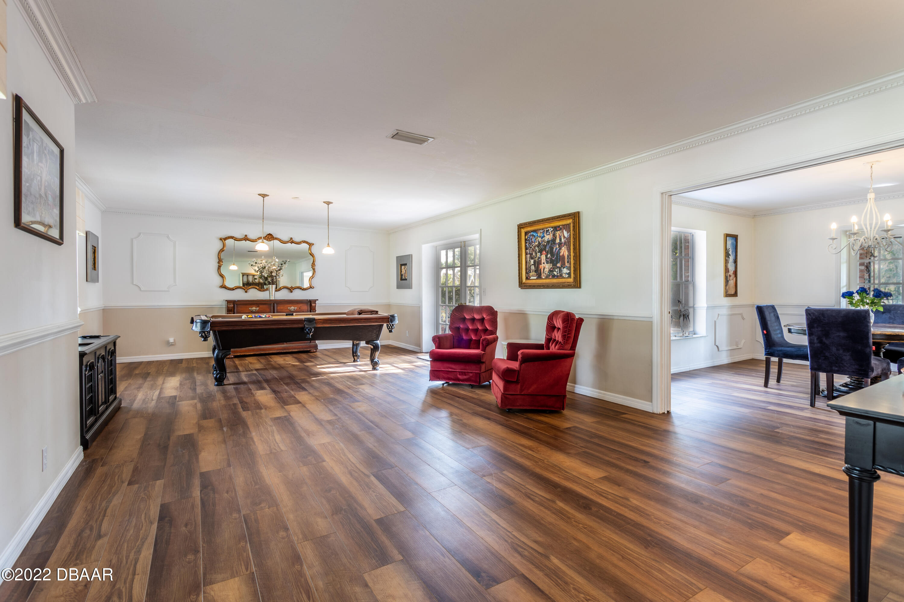 82 North St Andrews Drive Ormond Beach, FL 32174 - Photo 7 of 60 a living room with furniture and a wooden floor