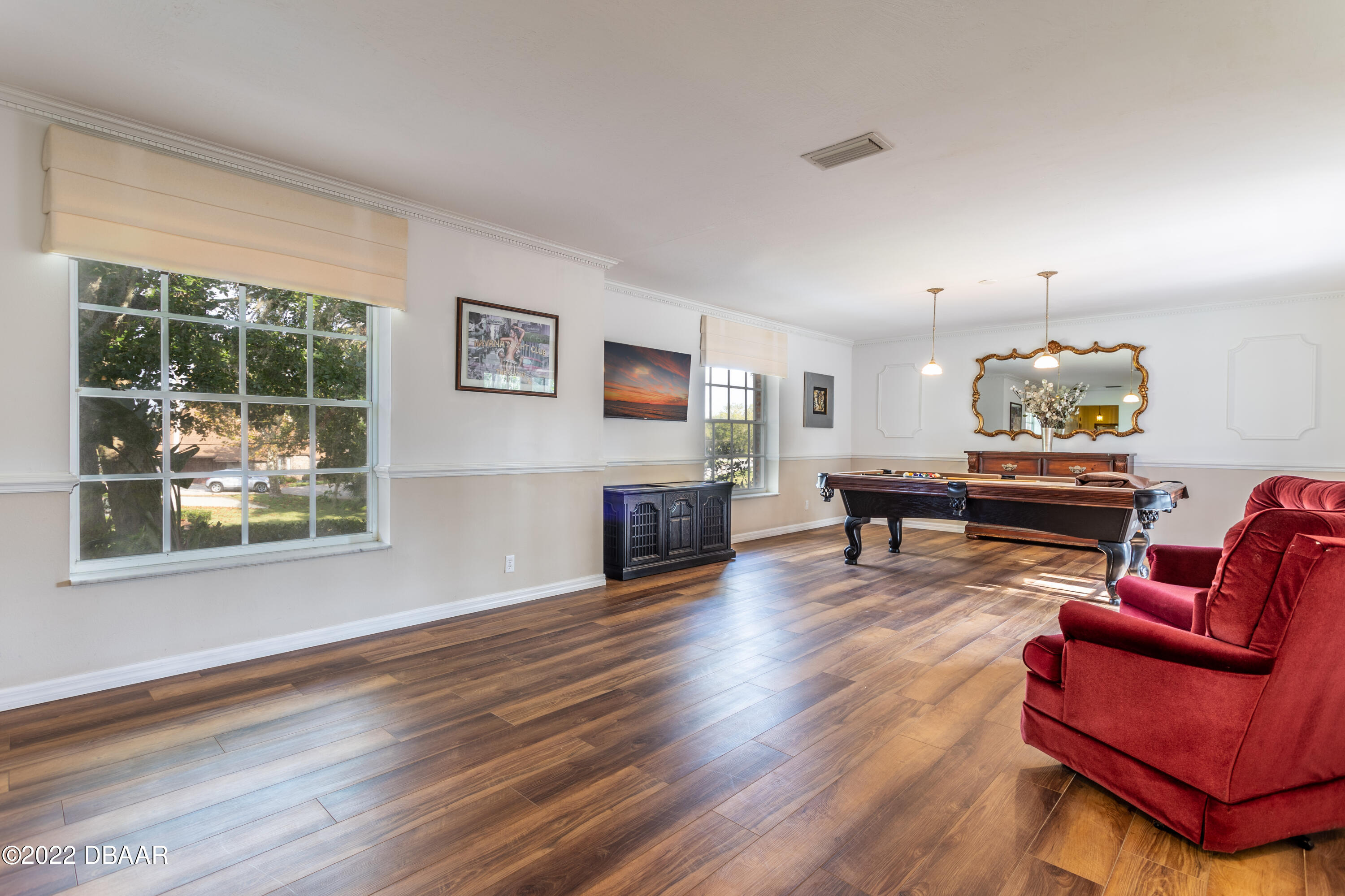 82 North St Andrews Drive Ormond Beach, FL 32174 - Photo 8 of 60 a living room with furniture and a wooden floor