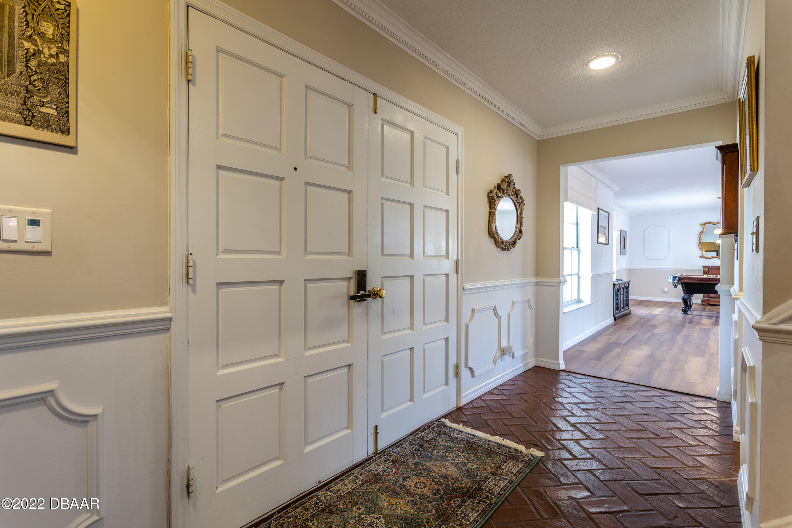 82 North St Andrews Drive Ormond Beach, FL 32174 - Photo 10 of 60 a living room with white cabinets and wooden floor