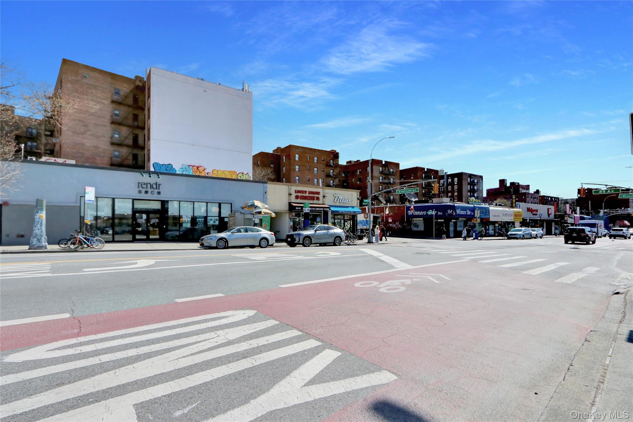45-16 83rd Street, Unit E2J Queens, NY 11373 - Photo 14 of 15 a car parked on the side of the road