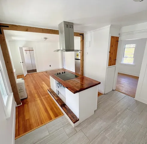 a kitchen with stainless steel appliances granite countertop a sink and a stove