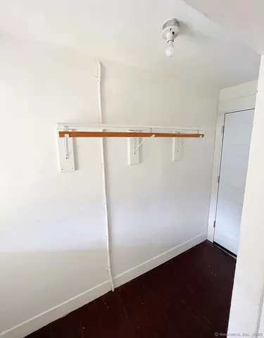 a bathroom with a tub shower and a sink