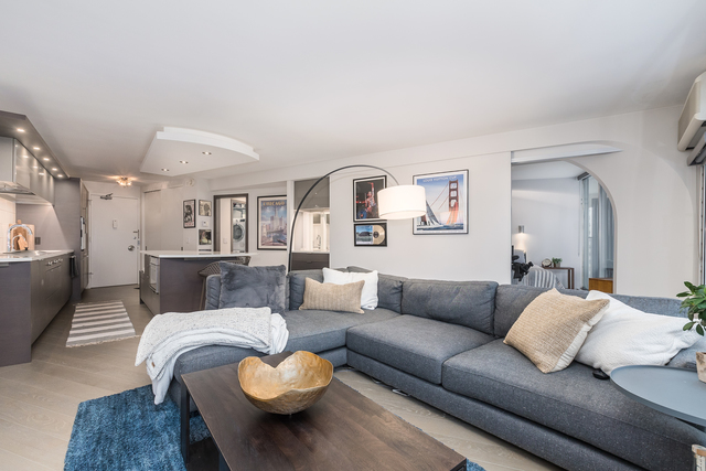 300 North State Street, Unit 2512 Chicago, IL 60654 - Photo 4 of 17 a living room with furniture and a couch