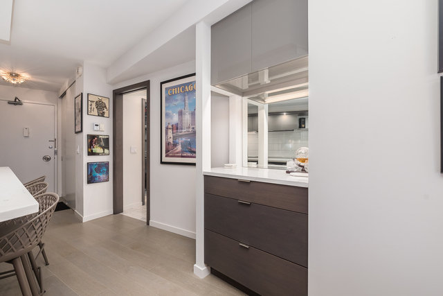 300 North State Street, Unit 2512 Chicago, IL 60654 - Photo 8 of 17 a bathroom with a sink and a mirror