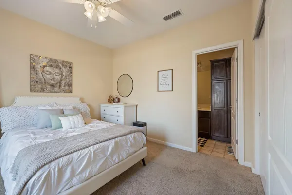 a large kitchen with kitchen island granite countertop wooden cabinets a granite counter tops and a stove