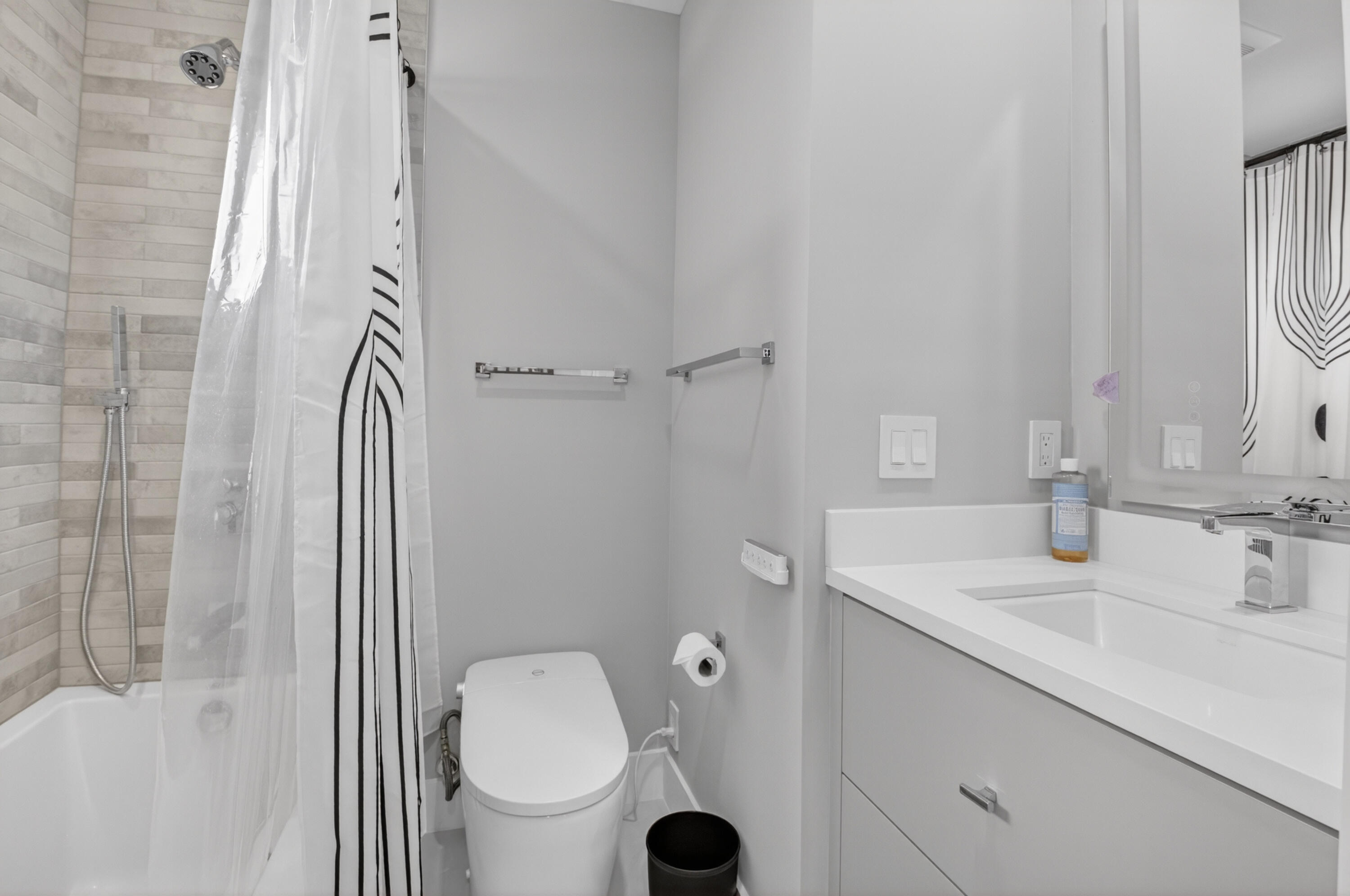 19221 Sabal Lake Drive, Unit 5124 Boca Raton, FL 33434 - Photo 39 of 98 a bathroom with a sink a toilet and shower