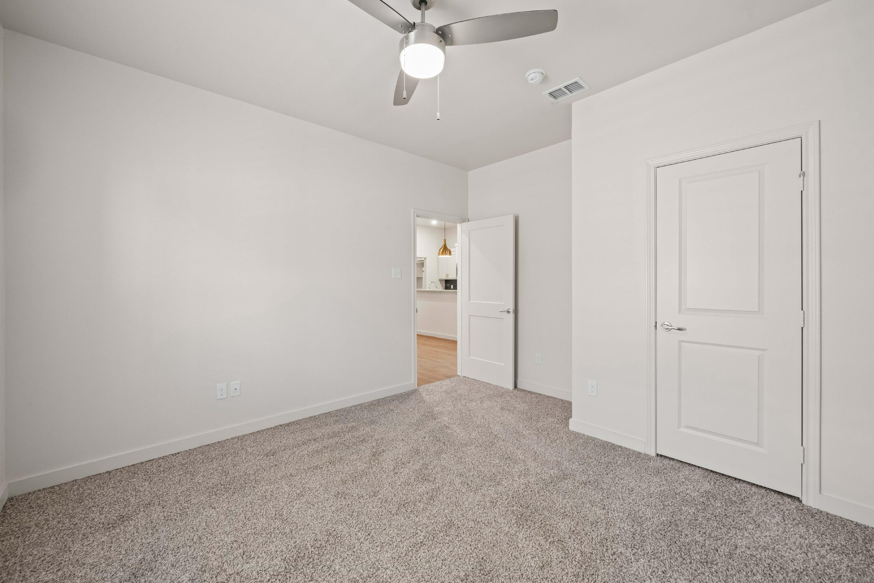 7014 40th Street, Unit A Lubbock, TX 79407 - Photo 11 of 19 wooden floor in an empty room