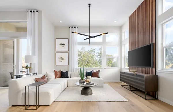 a large bedroom with a bed and window