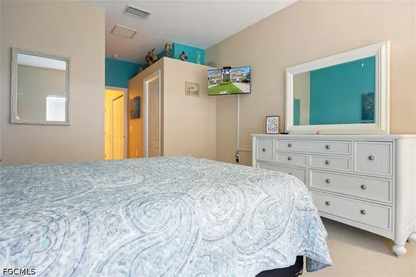 a view of a garden with a bench in the background