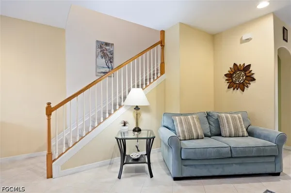 a kitchen with white cabinets and a sink