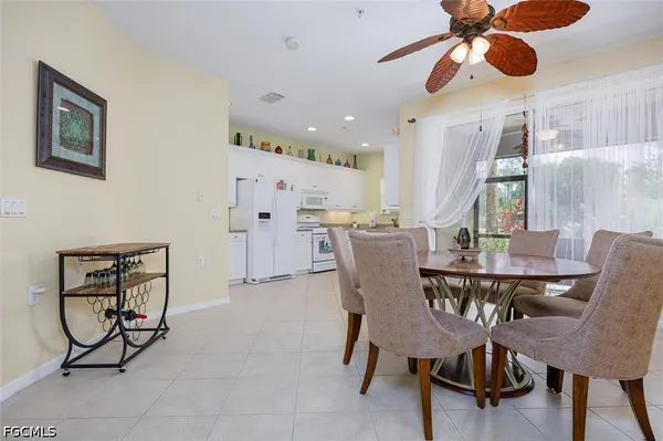 a kitchen with cabinets appliances a sink and a window