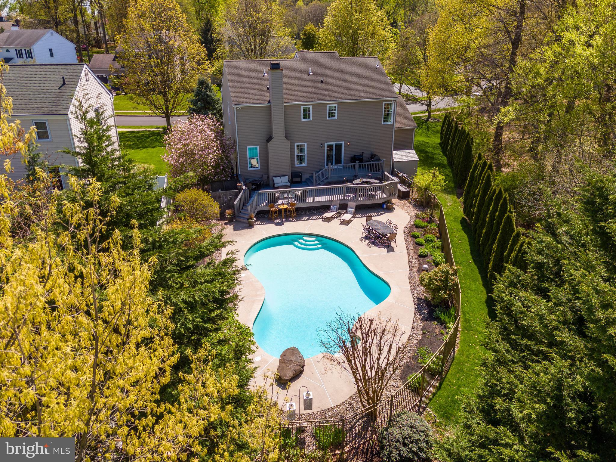 an aerial view of a house with swimming pool and 