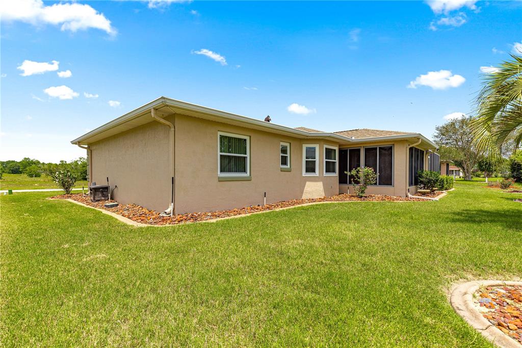 9958 Southwest 59th Circle Ocala, FL 34476 - Photo 32 of 45 a view of a house with a backyard