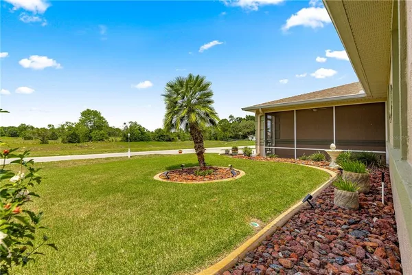 a swimming pool with trees in the background
